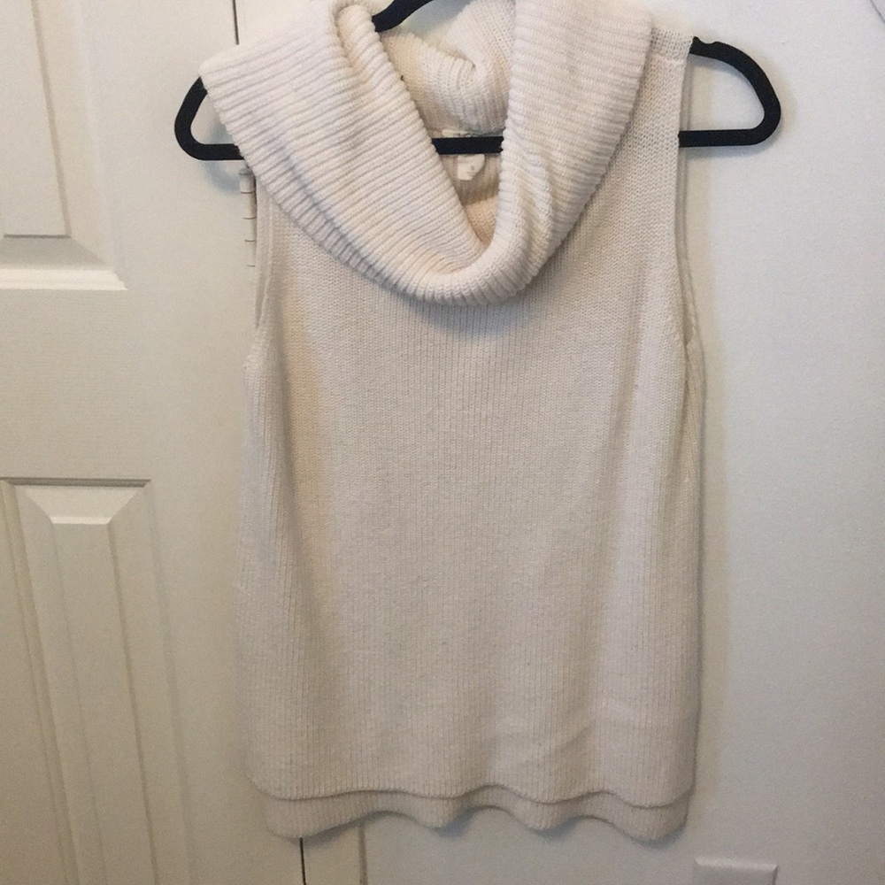 Sleeveless turtleneck cream top